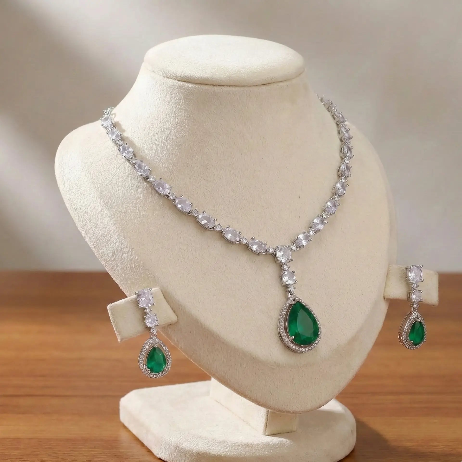 Jewelry set with necklace and earrings on a mannequin bust