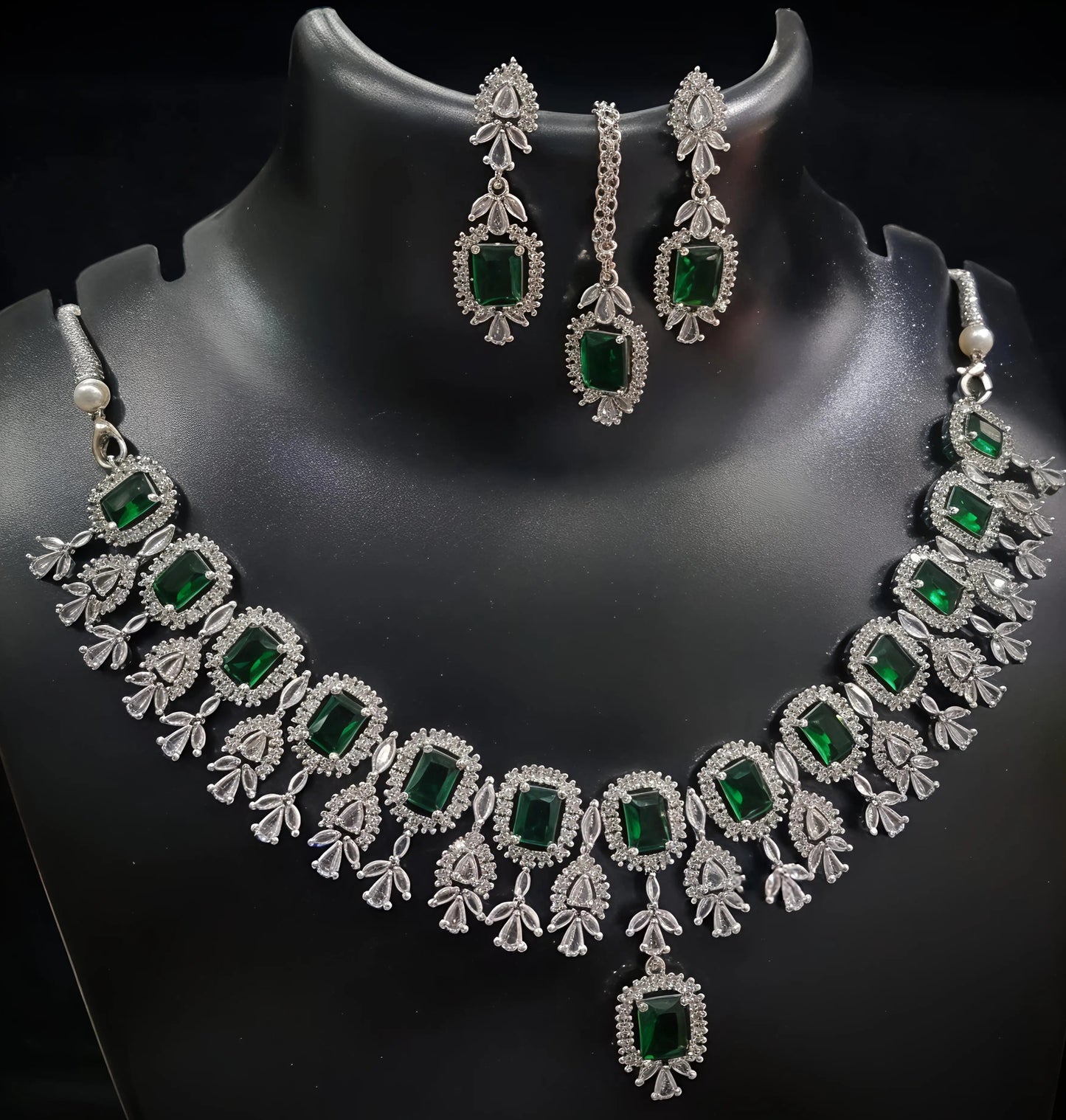 Jewelry set with necklace and earrings on a black mannequin