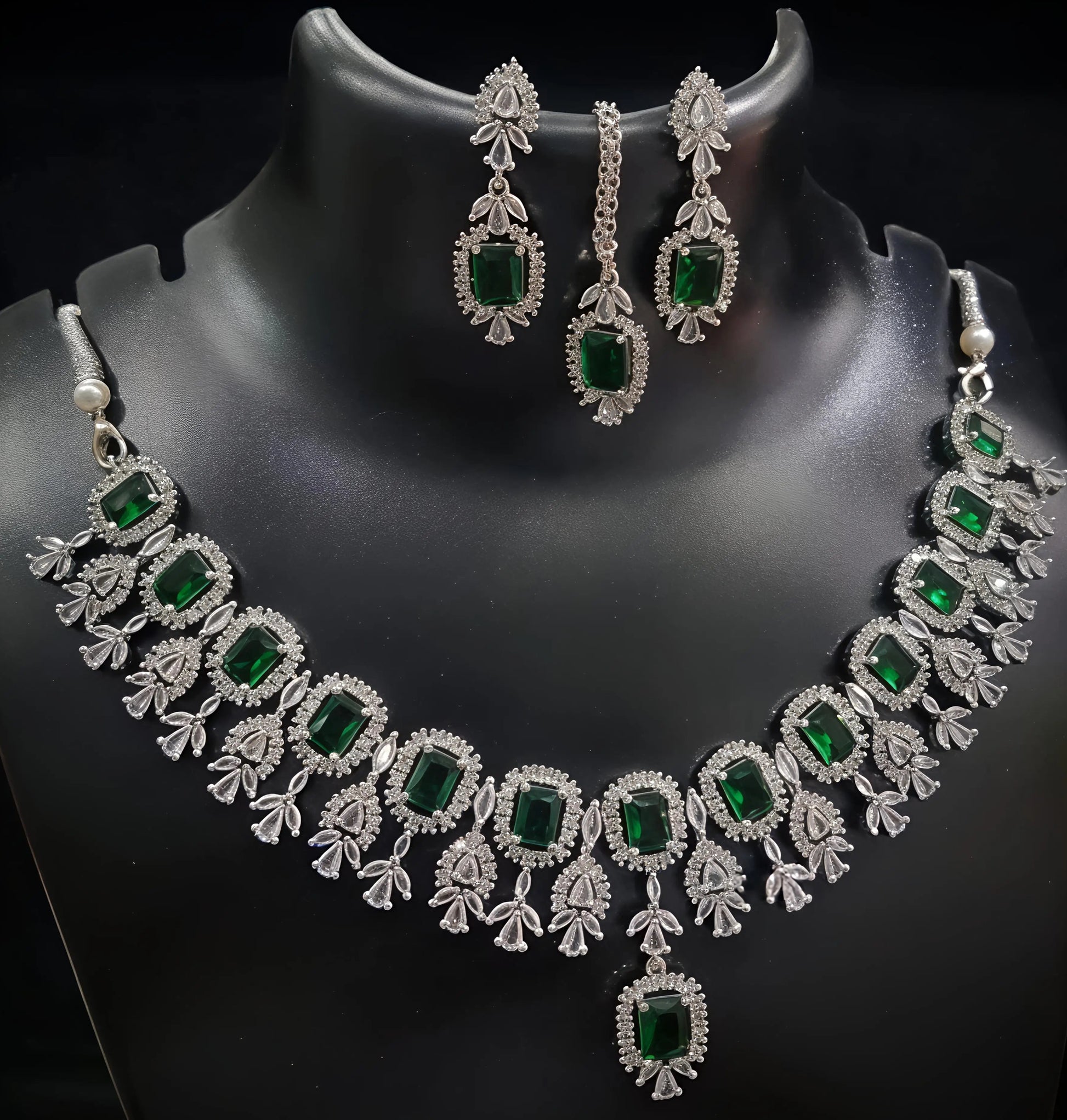 Jewelry set with necklace and earrings on a black mannequin